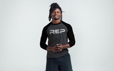 The REP Fitness Men's Daily Driver ¾ Sleeve Tri-Blend Crew T-Shirt in Heather Black/White on body