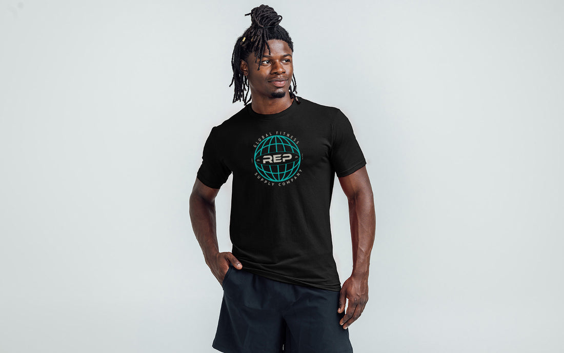 Athlete wearing the REP Fitness Worldwide Tri-Blend Crew T-Shirt in Heather Black with a blue graphic