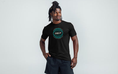 Athlete wearing the REP Fitness Worldwide Tri-Blend Crew T-Shirt in Heather Black with a blue graphic