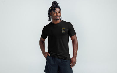The REP Fitness Repetition Tri-Blend Crew T-Shirt in Heather Black/Tan on body