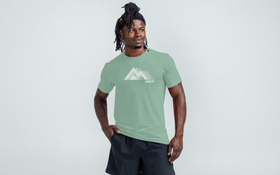 The REP Fitness Summit Tri-Blend Crew T-Shirt in Heather Sage/White front, on model