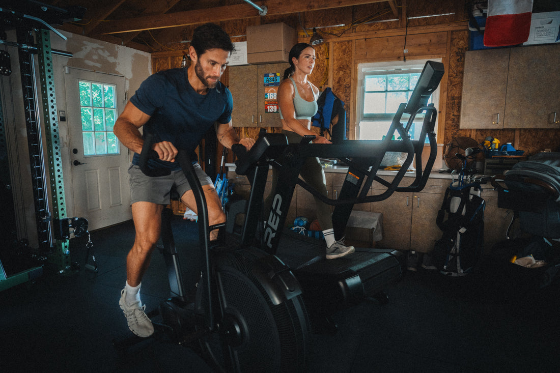 Athletes using the REP Fitness Strive Air Bike and Strive Curved Treadmill in a garage
