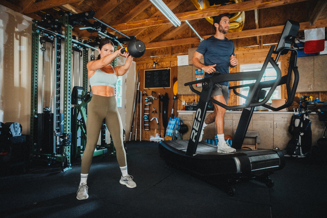 Athletes using the REP Fitness Strive Curved Treadmill and kettlebells in a garage