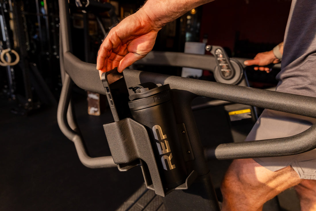 The REP Fitness Strive Curved Treadmill's water bottle and phone holder