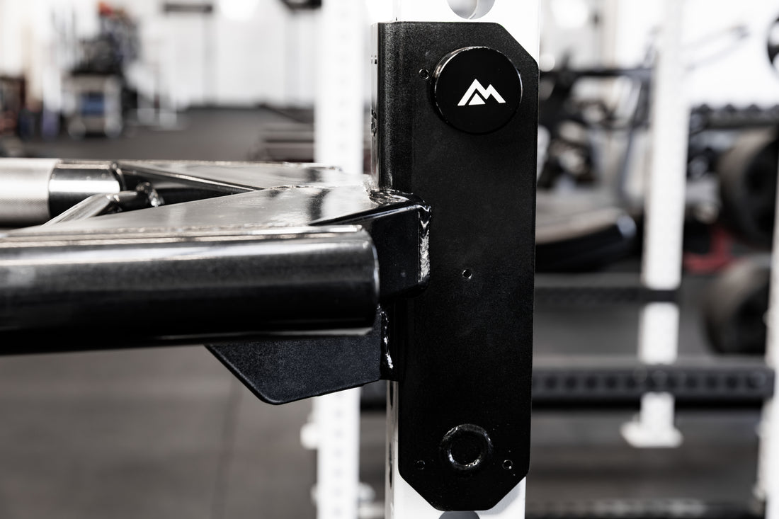 Close-up of the mag pin that secures the REP Fitness Dip Attachment 2.0 to a 5000 series power rack upright