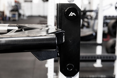 Close-up of the mag pin that secures the REP Fitness Dip Attachment 2.0 to a 5000 series power rack upright