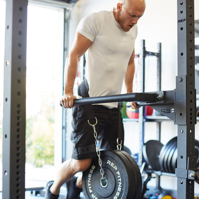 Athlete doing weighted dips on the REP Fitness Dip Station for the 4000 series