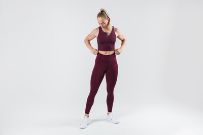 The REP Fitness Women's Eos Legging in Wine front, adjusting waistband