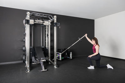 An athlete using the Kleva Adroit attached to the PR-5000 rack for a shoulder workout