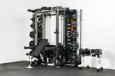 The REP Fitness Compact Home Gym Setup with the Wall-Mounted Ares 2.0, Nighthawk adjustable bench, and Equalizer™ Urethane-Coated Plates