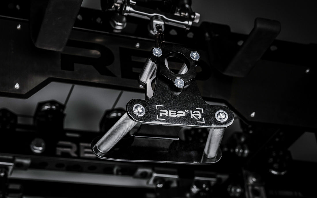 REP® x Kleva Built® Angled Atlas™ Close-Grip Cable and Landmine Attachment on the lat pulldown cable on an Ares™ 2.0