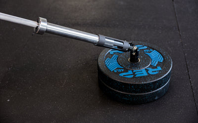 A barbell being slid into the polycarbonate sleeve of the Free Standing REP® x Kleva Built® Adroit Landmine