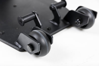Close-up shot of the wheels on the Leg Extension & Leg Curl Bench Attachment