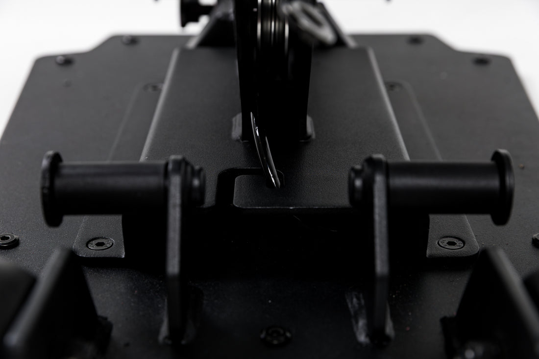Close-up shot of the band pegs and cable housing on the Leg Extension & Leg Curl Bench Attachment