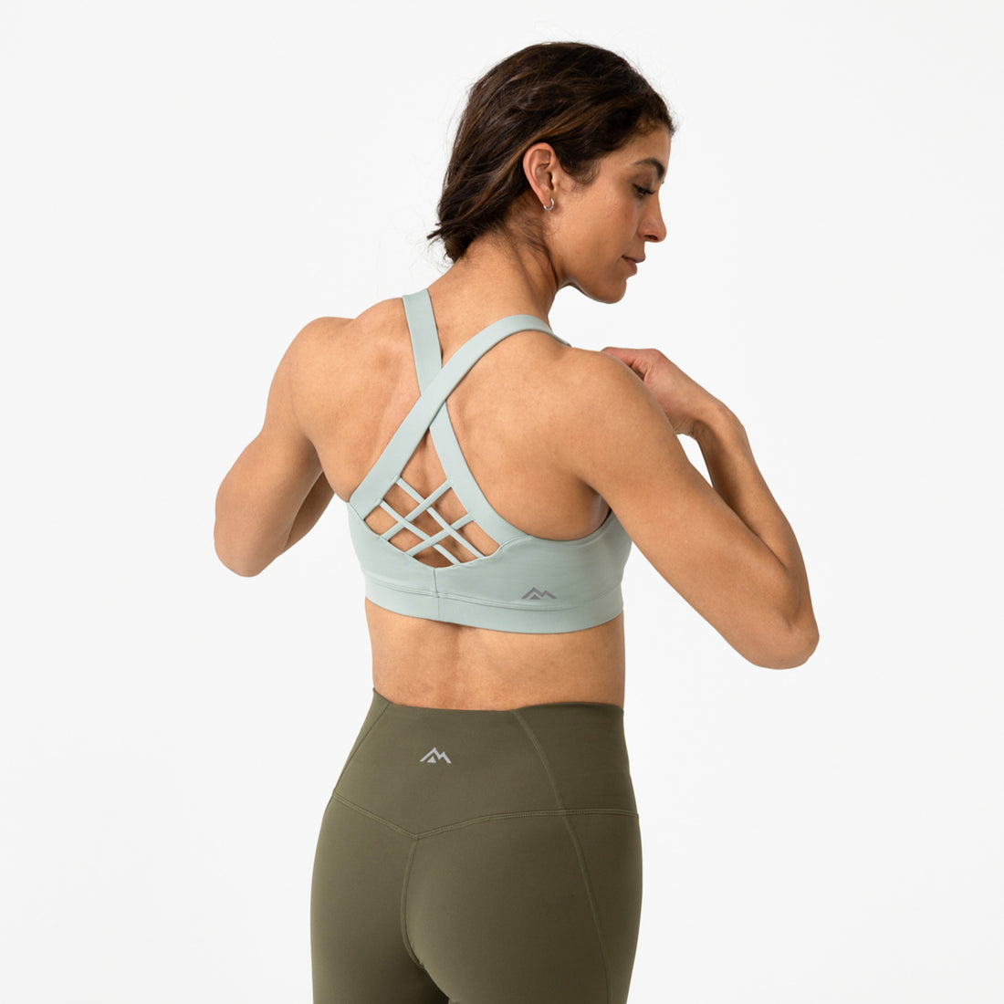 The REP Fitness Women's Lattis Sports Bra in Aqua Gray back, with leggings