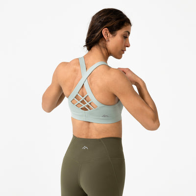 The REP Fitness Women's Lattis Sports Bra in Aqua Gray back, with leggings