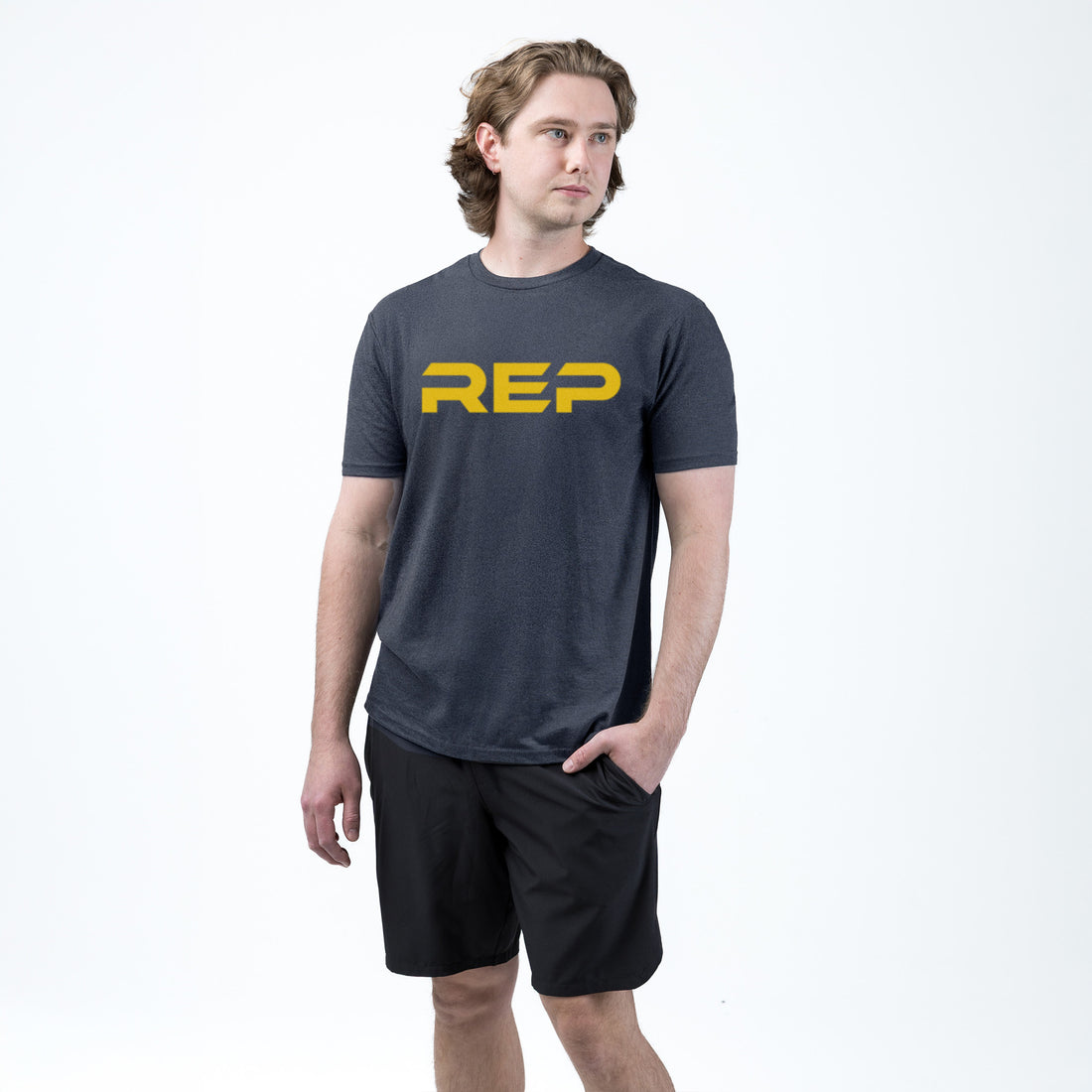The REP Fitness Men's Daily Driver 2.0 Tri-Blend Crew T-Shirt in Heather Navy/Yellow on body