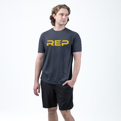 The REP Fitness Men's Daily Driver 2.0 Tri-Blend Crew T-Shirt in Heather Navy/Yellow on body