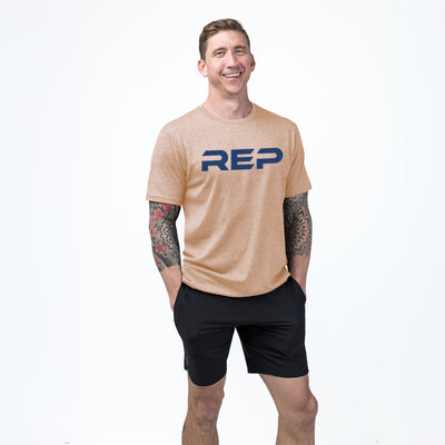 The REP Fitness Men's Daily Driver 2.0 Tri-Blend Crew T-Shirt in Heather Peach/Blue on body