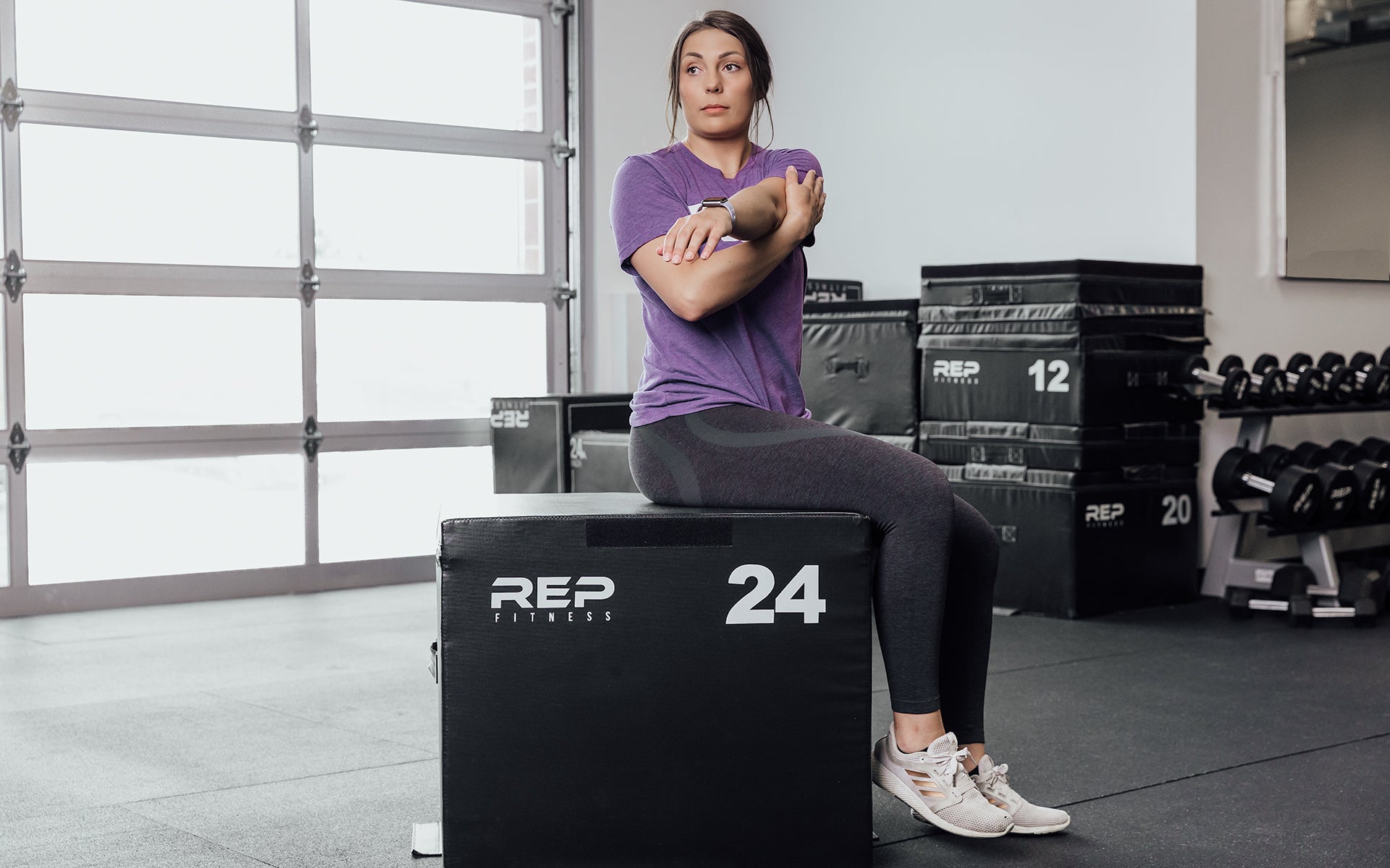 Female athlete stretching on a 24