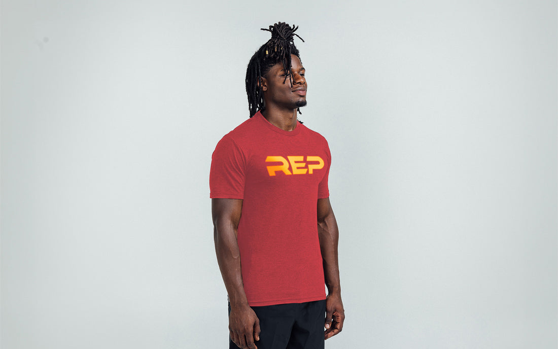 The REP Fitness Men's Daily Driver 2.0 Tri-Blend Crew T-Shirt in Heather Red/Gold on body