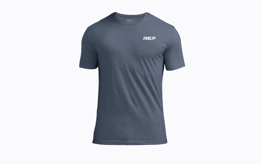 The REP Fitness Men's USA Tri-Blend Crew T-Shirt in Heather Navy/White front, flat lay