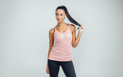 The REP Fitness Women's Daily Driver Tri-Blend Tank in Heather Rose/White on body