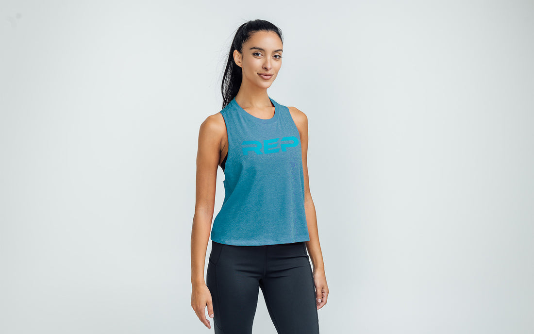The REP Fitness Women's Daily Driver Cropped Dual-Blend Tank in Heather Teal/Teal front