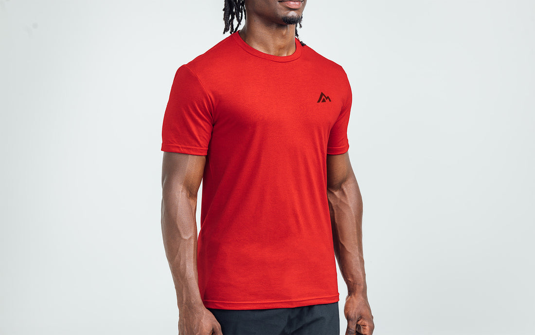 The REP Fitness Men's Peak Tri-Blend Crew T-Shirt in Heather Red/Black on body
