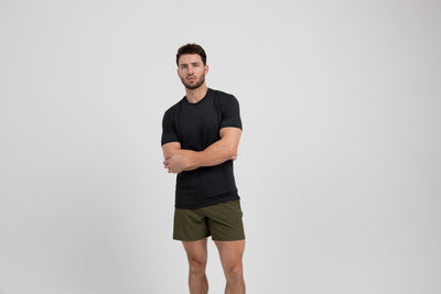 The REP Fitness Men's Delta Shirt in Black front, arms crossed