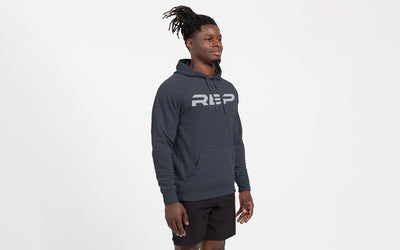 The REP Fitness Unisex Daily Driver 2.0 Pull Over Hoodie in Heather Navy/Silver front, side angle