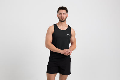 The REP Fitness Men's Peak Tri-Blend Tank in Heather Black/White front, on model