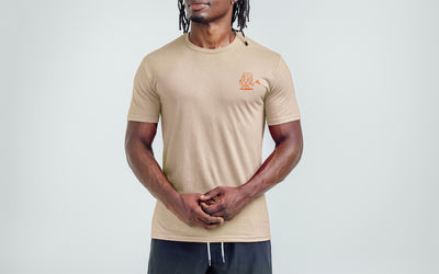 Athlete wearing the REP Fitness Men's Feeling Swell Tri-blend Crew T-Shirt in Heather Desert/Orange