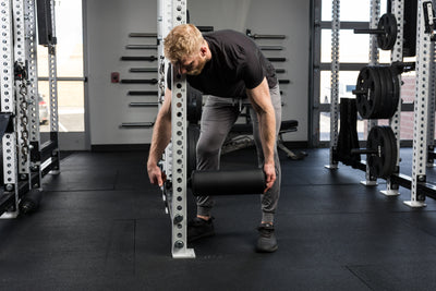 Athlete installing the Leg Roller 2.0