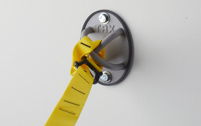 Close-up: A TRX Suspension Trainer™ attached to a TRX X-Mount® mounted on a wall