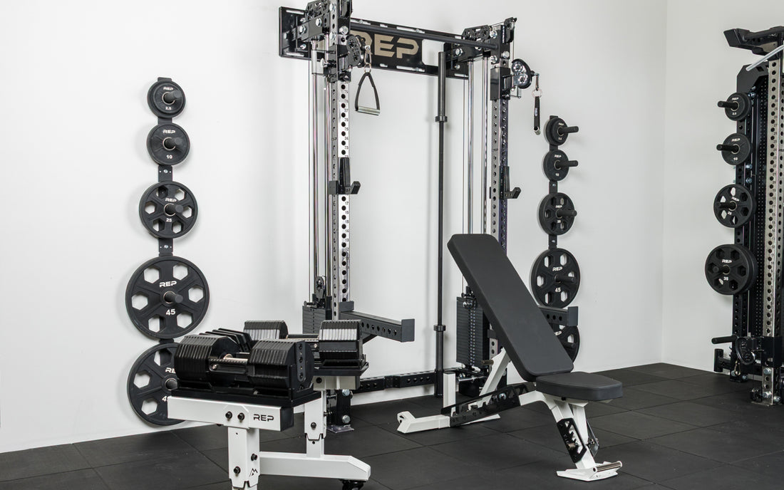 The REP Fitness Compact Home Gym Setup with the Wall-Mounted Athena, Nighthawk adjustable bench, and Equalizer™ Urethane-Coated Plates