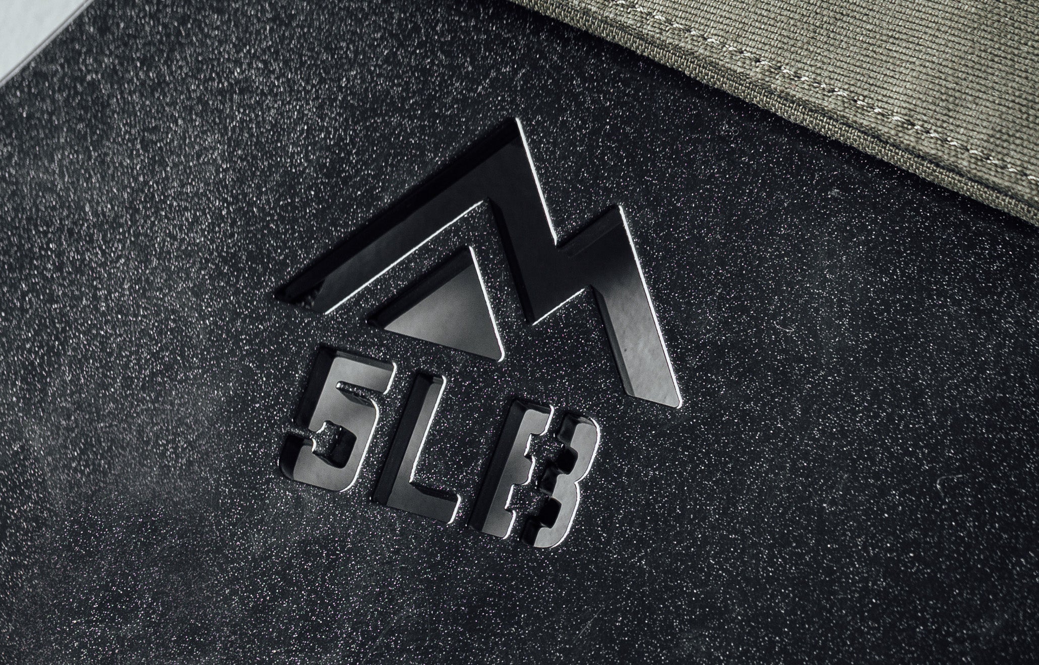 Mountain logo cutout and weight cutout on the Strata Weight Vest Plates
