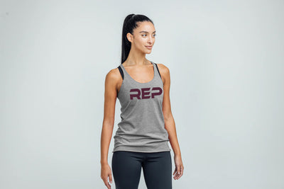 The REP Fitness Women's Daily Driver Tri-Blend Tank in Heather Gray/Wine on body