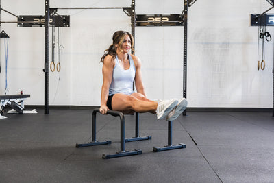 Athlete doing an L-Sit on the REP Fitness Parallette Bars