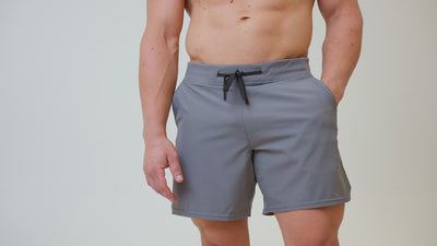 Athlete wearing the REP Fitness Men's Pinnacle Shorts in Dusty Blue