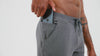 Athlete wearing the REP Fitness Men's Attis Joggers in Heather Olive, Heather Black, Heather Cool Gray design detail