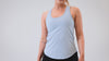 Athlete wearing the REP Fitness Women's Clio Tank Top in Olive, Black, Periwinkle
