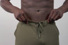 Athlete wearing the REP Fitness Men's Attis Joggers in Heather Olive, Heather Black, Heather Cool Gray close-up
