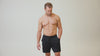Athlete wearing the REP Fitness Men's Attis Shorts in Heather Olive, Heather Black, Heather Cool Gray