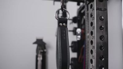 Athletes working out on an Ares 2.0 with the REP® USA Leather Single Handle Cable Attachments