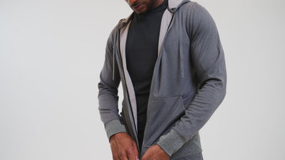 Athlete wearing the REP Fitness Men's Attis Jacket in Heather Olive, Heather Black, Heather Cool Gray