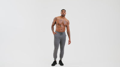 Athlete wearing the REP Fitness Men's Attis Joggers in Heather Olive, Heather Black, Heather Cool Gray