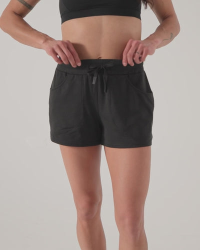 Athlete wearing the REP Fitness Women's Vellus Shorts in Black, Cool Gray