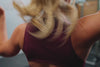 Video of an athlete performing deadlifts while wearing the REP Rhea tank in Wine