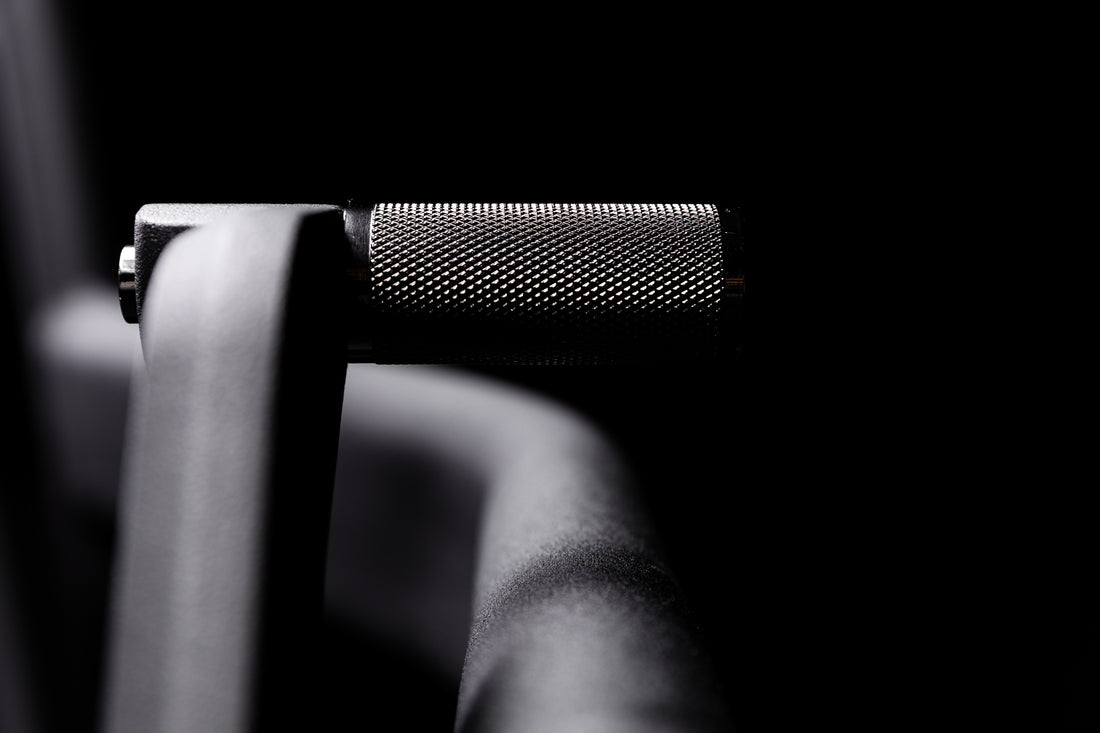 Close-up shot of the knurling on the resistance mode handle on the Strive Curved Treadmill